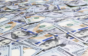 Stack of one hundred dollar bills. Stack of cash money in hundred dollar banknotes. Heap of hundred...