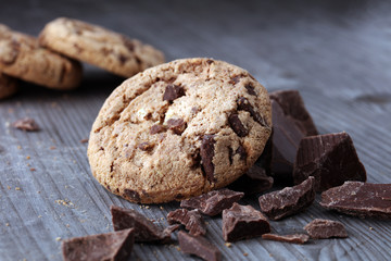 Chocolate cookies on wooden table. Chocolate chip cookies shot.