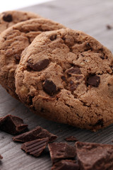 Chocolate cookies on wooden table. Chocolate chip cookies shot.