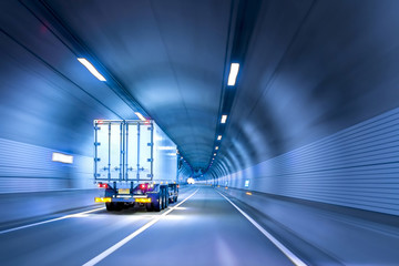 Truck passing through tunnels for safe and fast transport. - obrazy, fototapety, plakaty