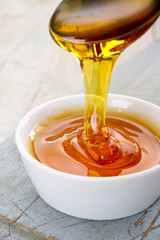 refined golden sugar syrup in dish