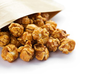 Caramel popcorn on white background.