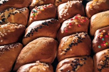 fresh sweet baked buns set on wood;