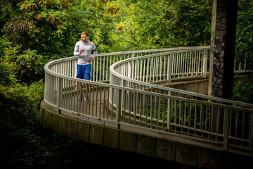 Young man jogging through the countryside