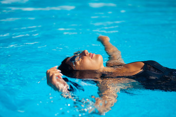 Beautiful woman in the pool