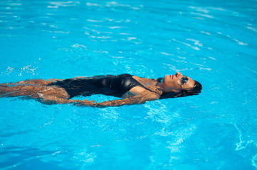 Beautiful woman in the pool