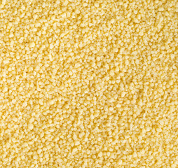 Raw, uncooked couscous background