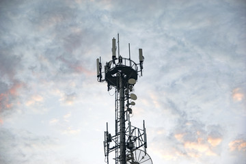 Antenna Tower transmission against a blue sky with clouds