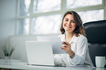 Young woman in office working