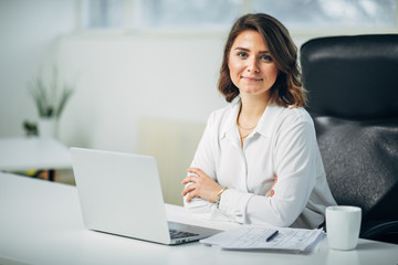 Young woman in office working