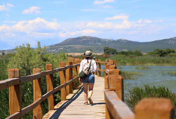 Fototapeta na wymiar woman on the bridge in croatia, wooden bridge 