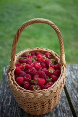 Fototapeta na wymiar fresh raspberries in a basket