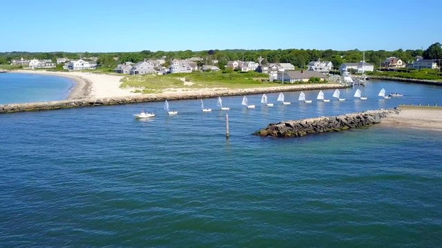 Students Learning How to Sail Leave Falmouth Harbor in a Line Formation Behind Thier Instructor