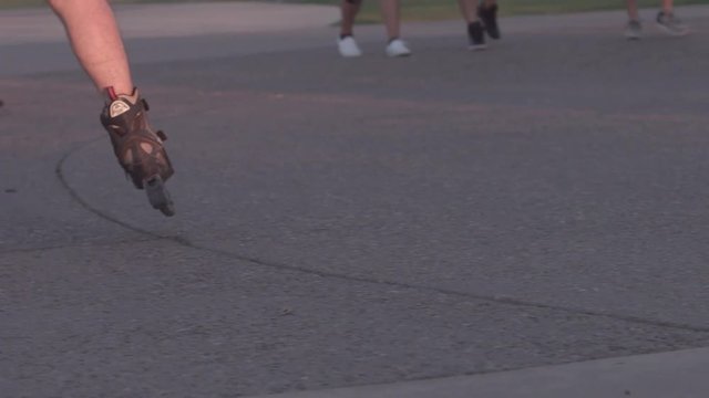 Roller blader out for an evening exercise.