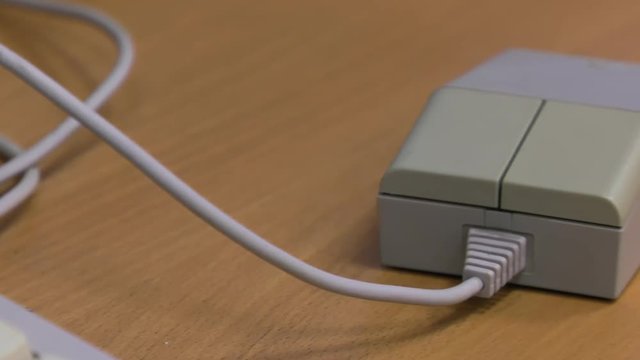 White vintage computer mouse  for  computer or game console from the 90s. , Panning, closeup. 