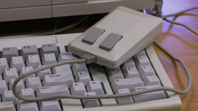 White vintage computer mouse  for  computer or game console from the 90s. , Panning, closeup. 