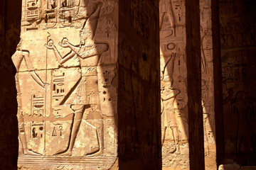 Egyptian symbols on the pillars of ancient temple in Luxor