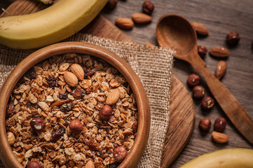 Homemade Granola with blueberries in a wooden bowl