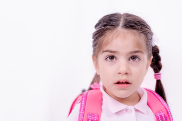Portrait of cute little girl in school uniform
