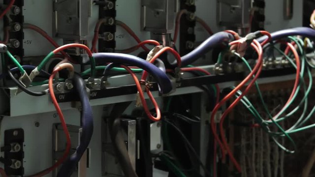 A antique working device. Very old computer counting the number of PI. Retro style.  Panning. Closeup.