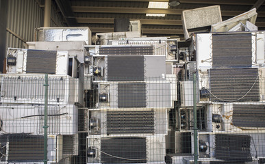 Huge piles of refrigerators stacked at recycling plant