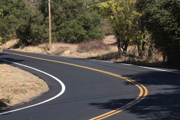 Fototapeta premium Two lane, winding paved country road in southern califonia