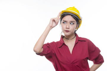 Engineering woman pointing in red shirt with yellow safety helmet in Studio light, occupation concept, Construction preparation, Happy worker