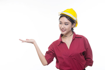 Engineering woman pointing in red shirt with yellow safety helmet in Studio light, occupation concept, Construction preparation, Happy worker