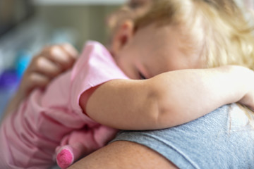 mother hugging child in sunlight