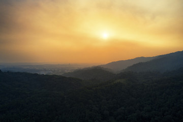 Fototapeta premium Sunset over mountains captured from aerial perspective