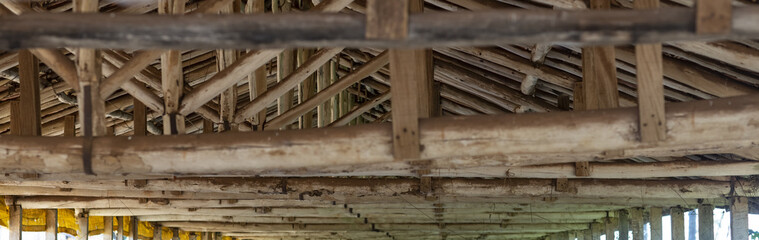 Wooden beams - building material of roof , wooden components for carpenter work. eucalipto background. 