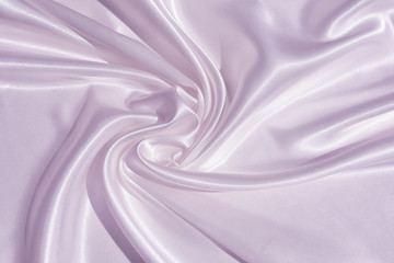 The texture of the satin fabric of lilac color for the background 