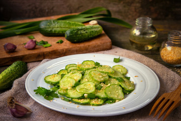 Fresh salad of cucumbers with sesame seeds.