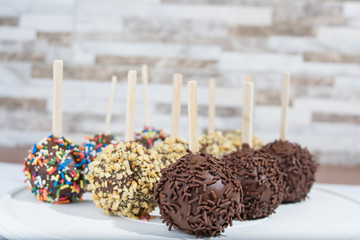 chocolate lollipop with colorful sparks with peanuts and chocolate sparks