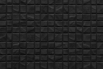Black modern stone tile wall pattern and background