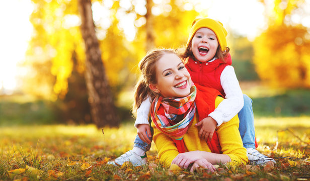 happy family mother and child daughter on   autumn walk .