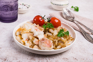 Slices of fried fish with vegetables