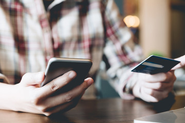 Smart woman using smart phone for online shopping with creditcard at home, Online Payment Concept