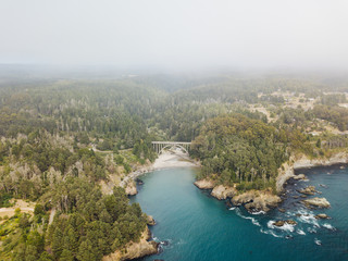 Fototapeta na wymiar Aerial Drone Shot Russian Gulch National Park Bridge Sea Forest Sky