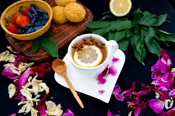 Cup of tea and mint on a dark background