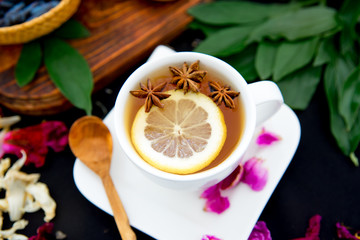 Cup of tea and mint on a dark background