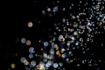 bokeh of water drops levitating in the air reflection