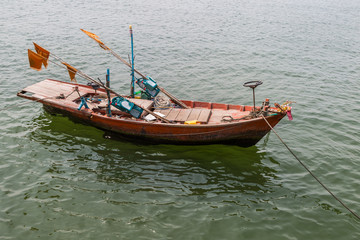 Naklejka na ściany i meble Orange wood fishing boat