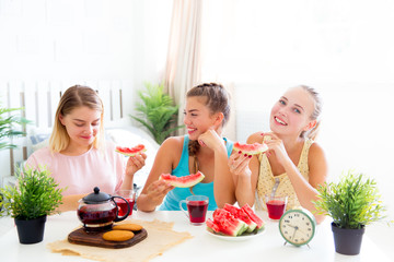 Girls having fun on slumber party eating