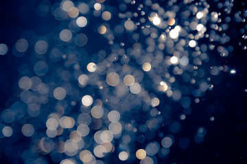 defocus bokeh of water drop on blue