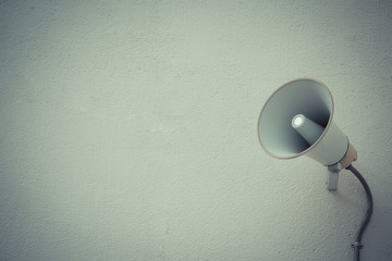 Vintage style color loudspeaker setting on the wall for present News in public