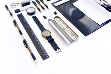 stationery pen scissors notebook on a wooden table