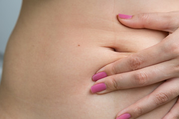 Obraz na płótnie Canvas Woman belly skin