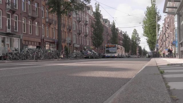 A bus pulling up in Amsterdam West. Filmed in slow motion in the late afternoon.