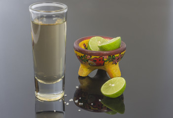 Tequila glass with lemon and grain salt